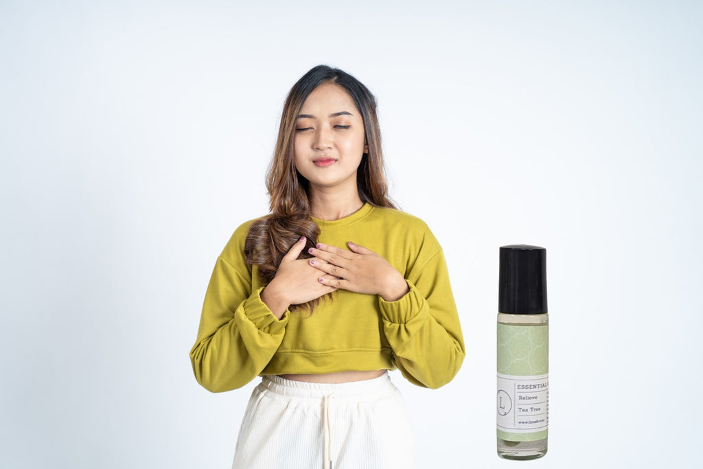 softly lit set of five crystal-infused essential oil roll-ons in a calming gift box