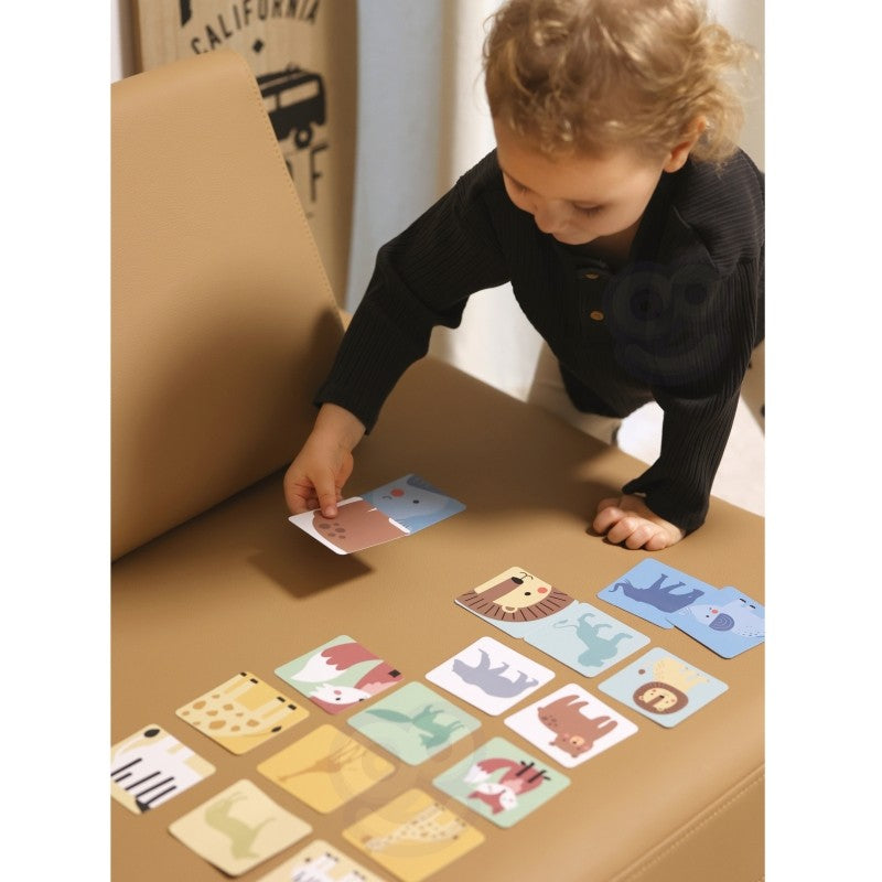 a practical overhead shot of the complete shaky tower game set with blocks, hammers, dice, and cards laid out