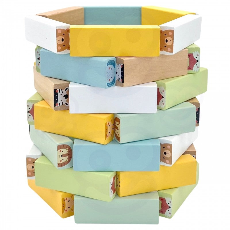 a child's hand carefully placing a pastel wooden block on the shaky tower during a game