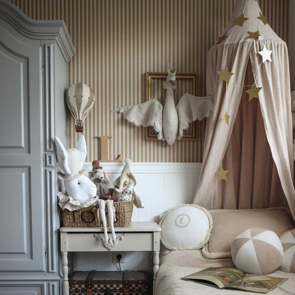 close-up detail of beige and brown vintage stripe wallpaper showing its matte paper texture and easy-to-match pattern