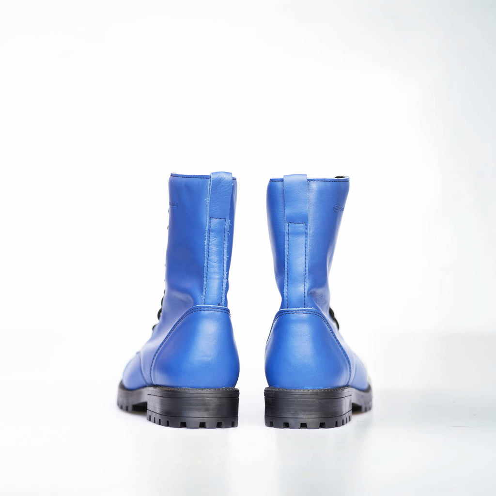elegant close-up of 511 blues punk-style boots in natural leather, highlighting refined craftsmanship and water-repellent texture
