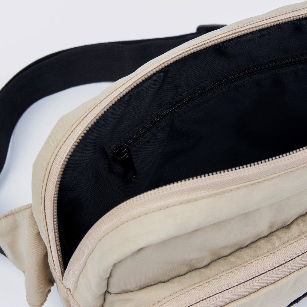 sniff the moomin character on a practical beige waist bag with an adjustable strap