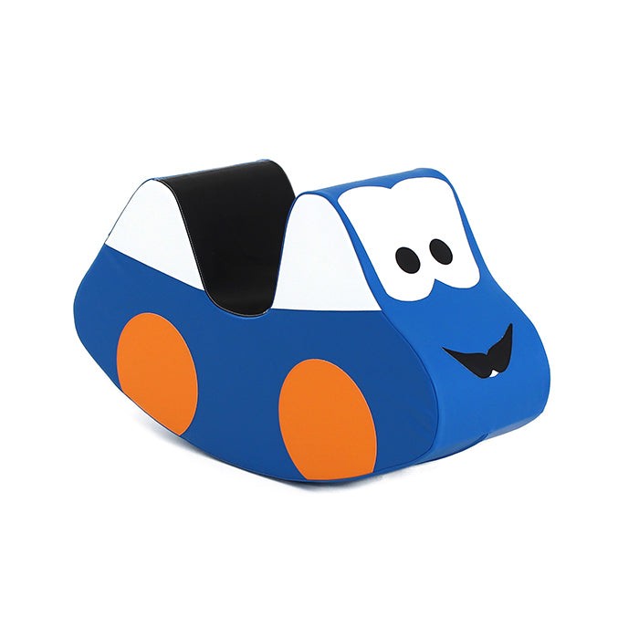 a child demonstrating how to ride the blue foam car toy on a hardwood floor