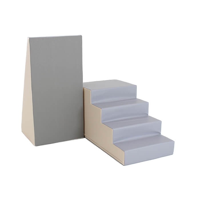 beige and grey soft play step and slide set with kids climbing and laughing in cozy indoor light