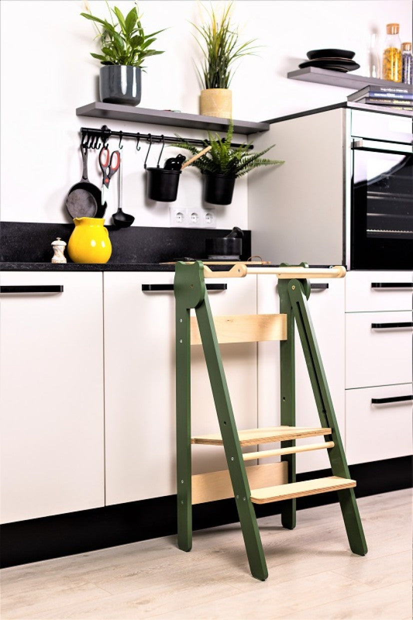 foldable baltic birch step stool for kids folded flat against a wall to save space