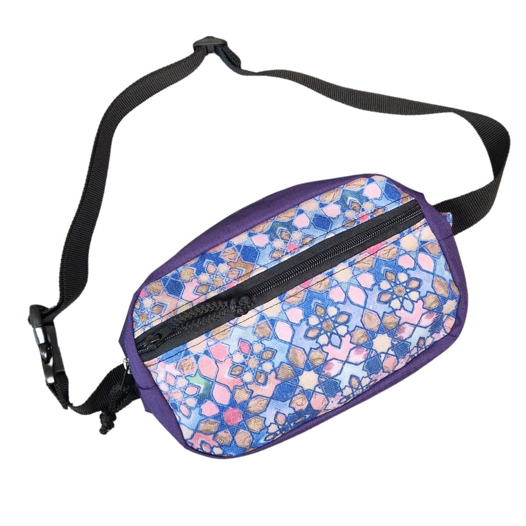 a playful shot of a handmade water-resistant waist bag worn crossbody on a sunny adventure