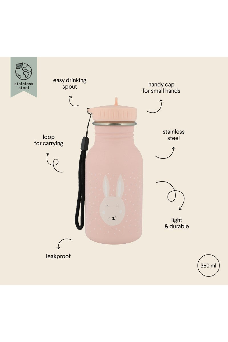 mrs bunny water bottle held by a child in a sunlit garden