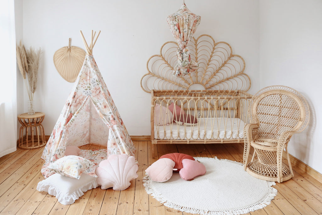 kids giggling inside a floral teepee tent with the curtain window open