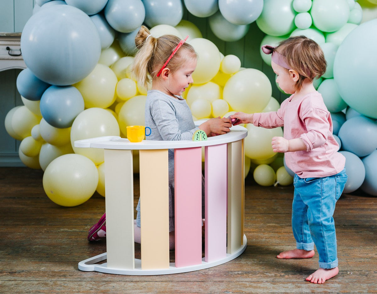 functional baby climber and swing set in a bright, sunlit playroom