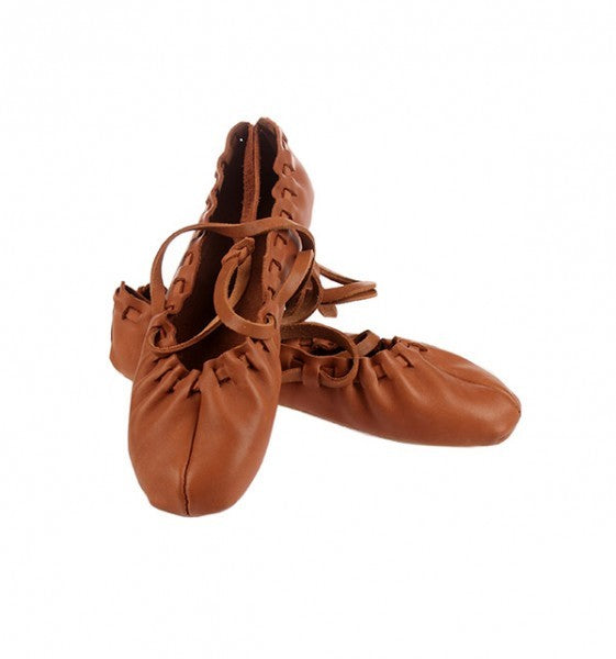 confident dancer in classic tied leather shoes with non-slip rubber soles, bold close-up on laces