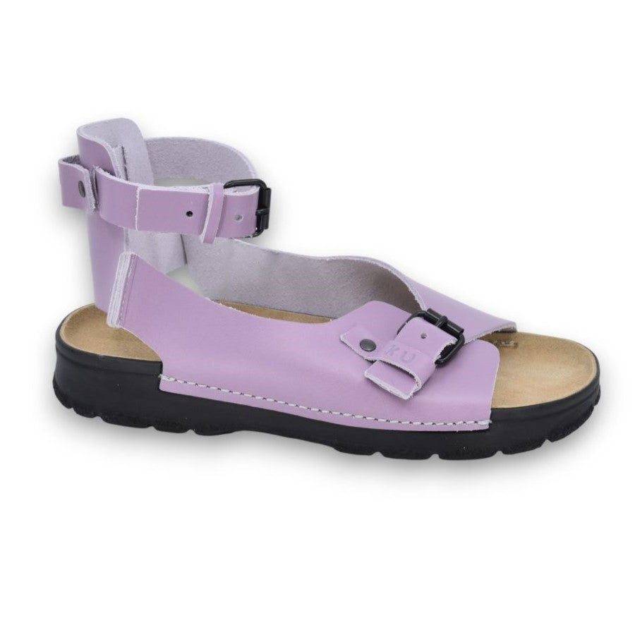bold orchid athens sandals on a sun-drenched stone path, showcasing the secure closed heel and leather patina