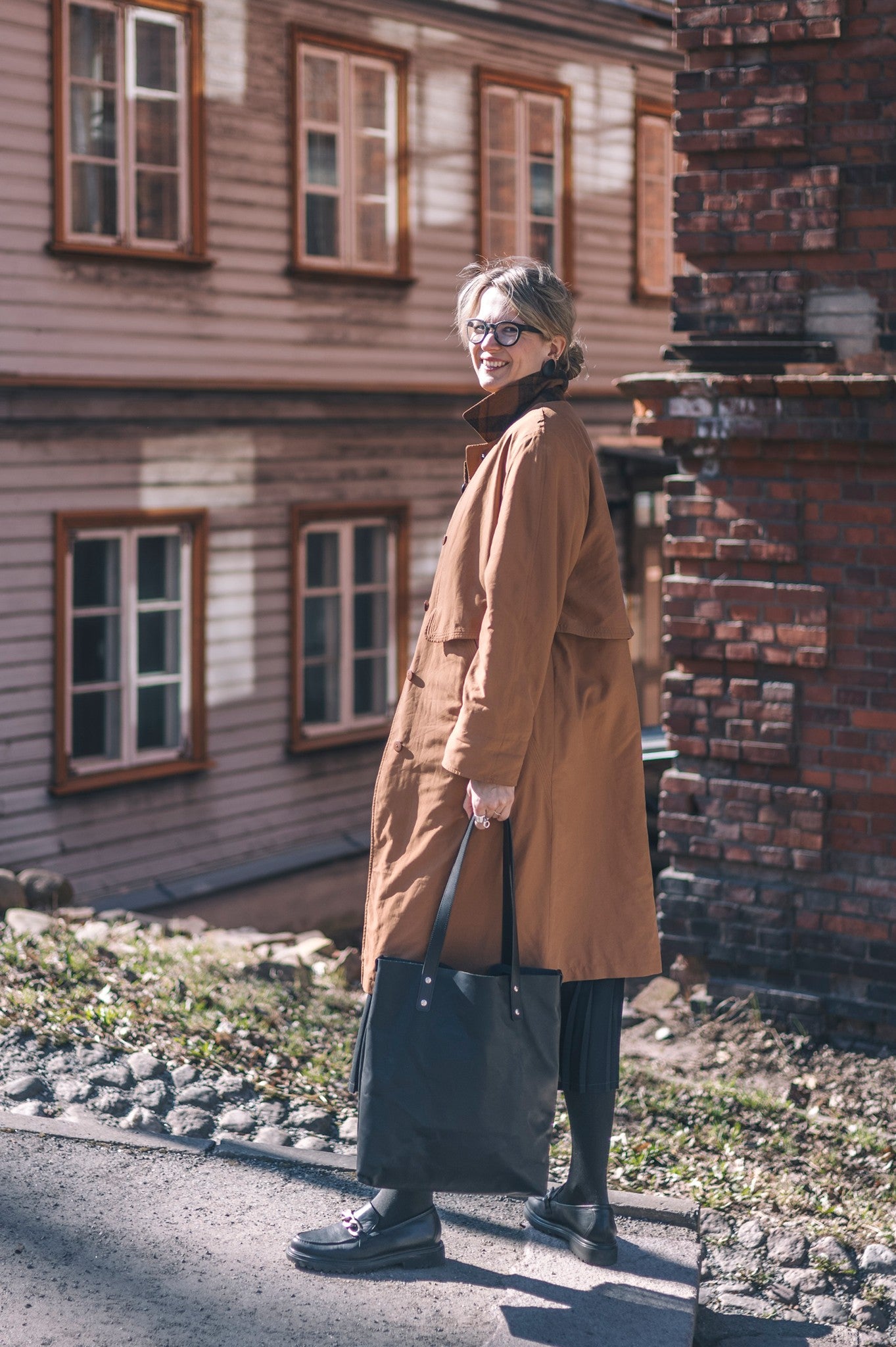 bold statement of the island hopper leather tote in dramatic studio lighting