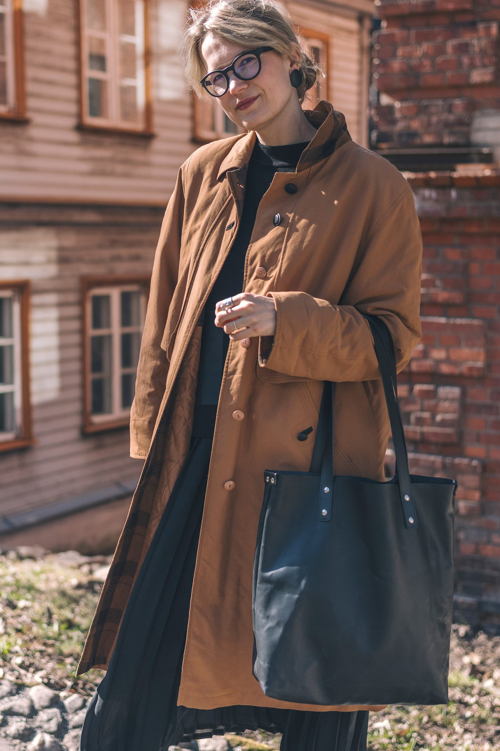 a soft, comforting close-up of the island hopper tote's vegetable-tanned leather texture in warm morning light