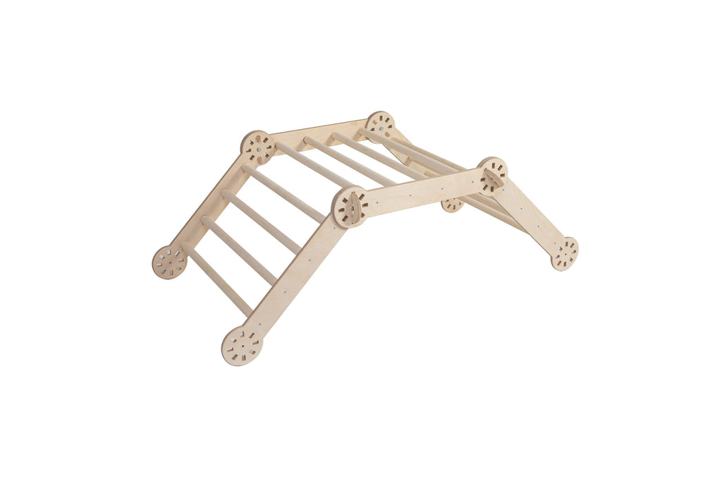 a child's focused hands gripping the sturdy baltic birch rungs of a montessori climber
