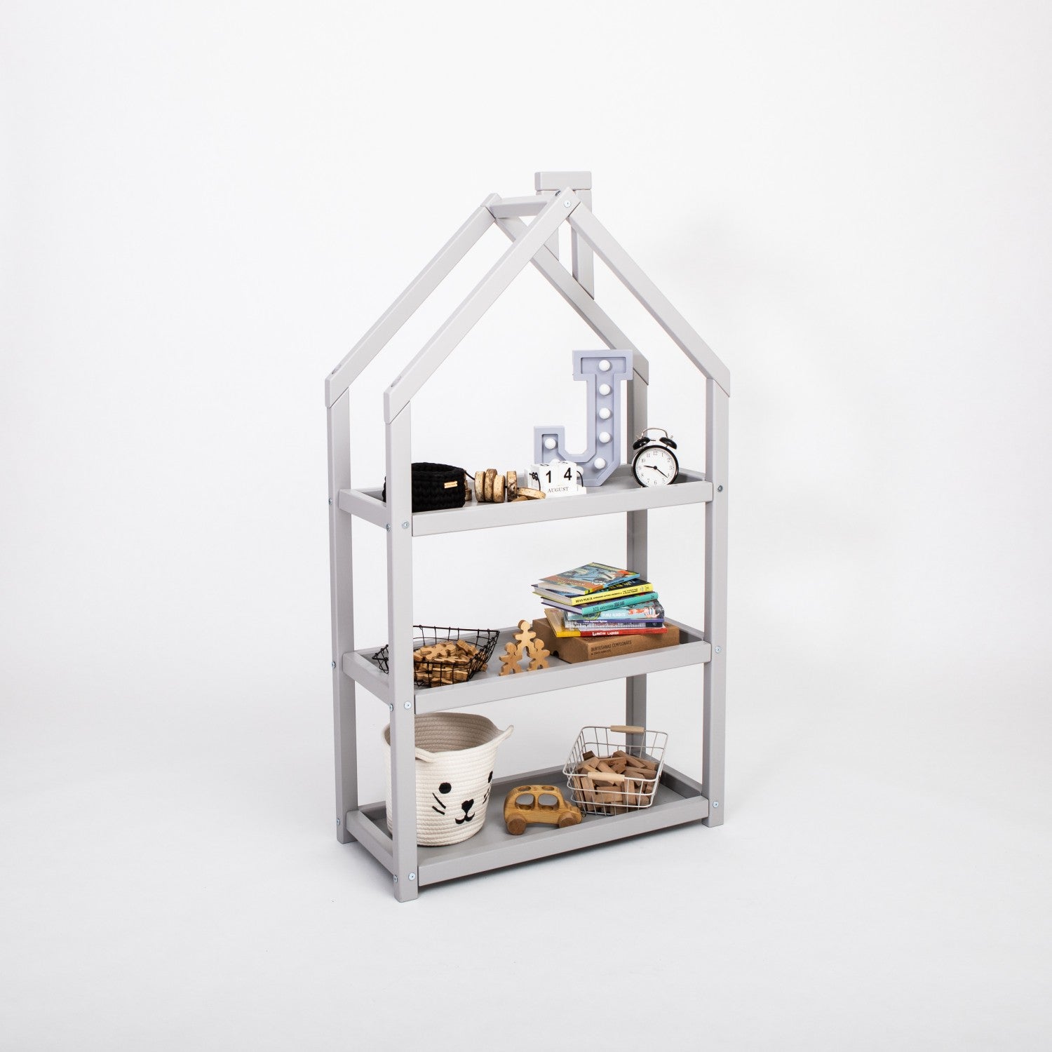 a playful grey house-shaped shelf for kids filled with colorful books and toys