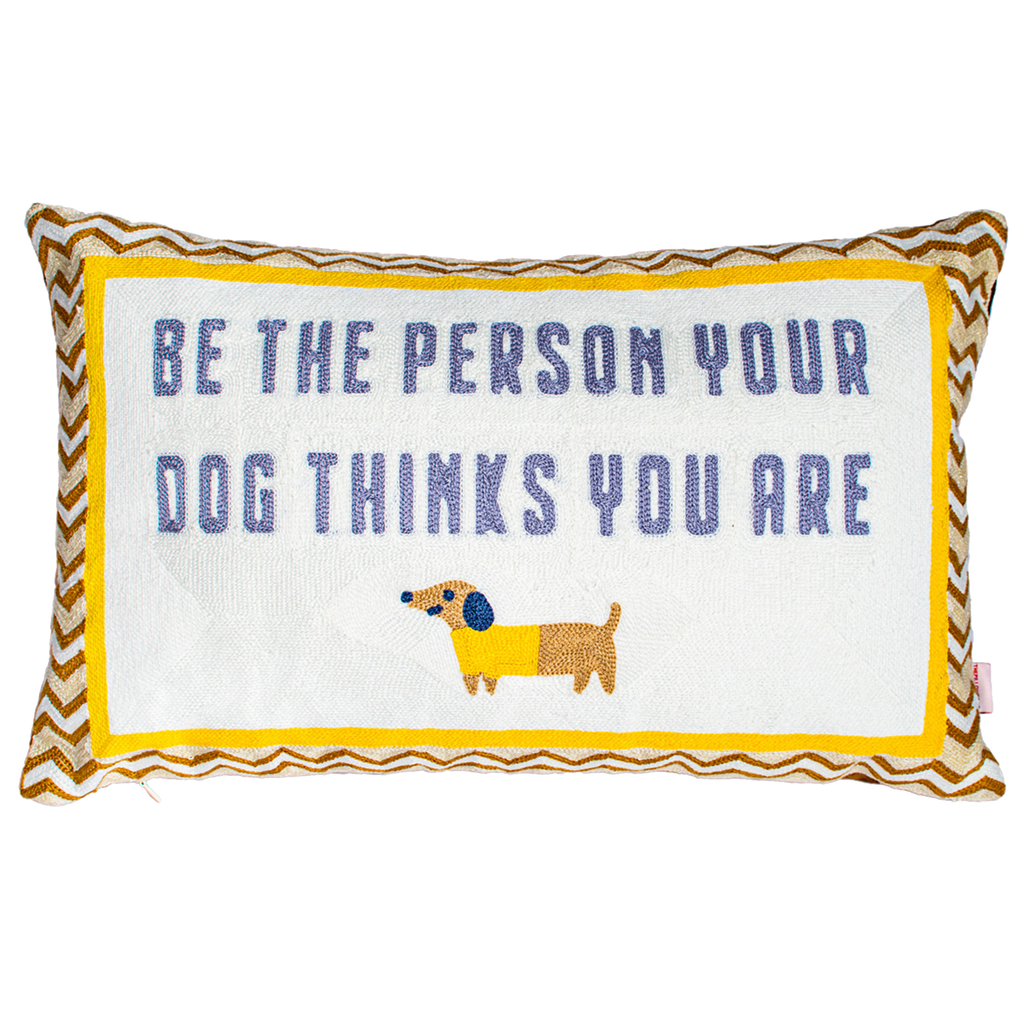 Decorative pillow with text 'Be the person your dog thinks you are' and a dachshund illustration on a white From The Pillow Drop at Sostterbackground.