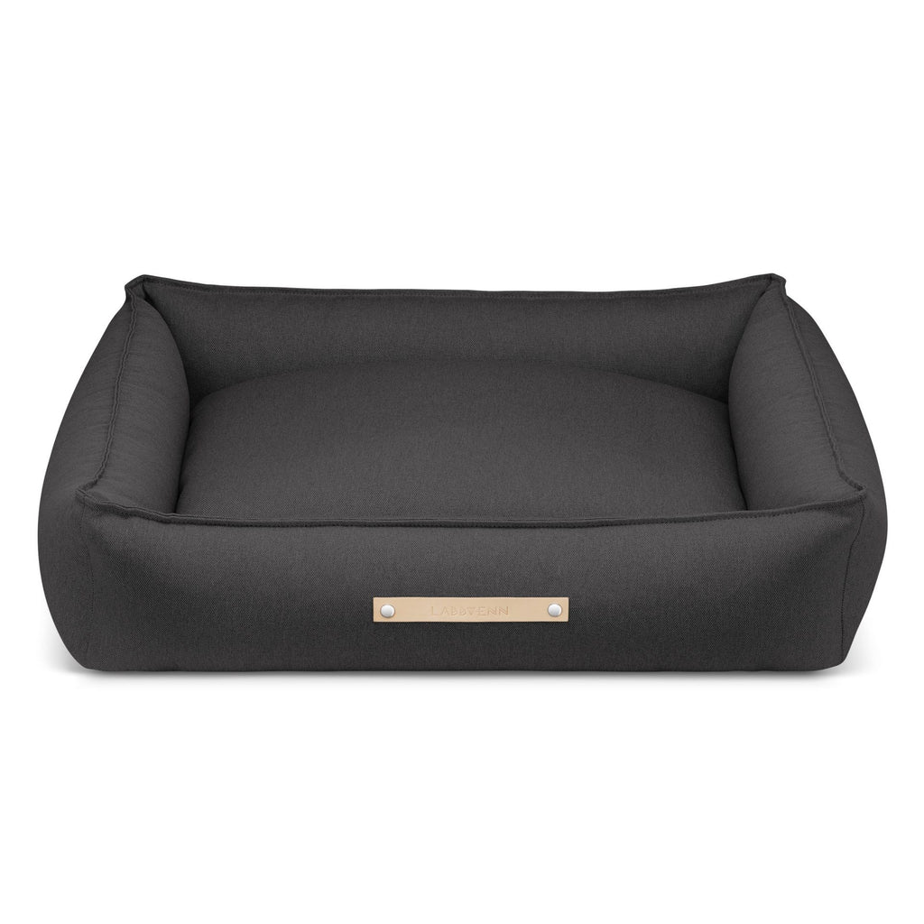 a cozy anthracite grey dog bed with soft, high sides for a comforting snuggle nest