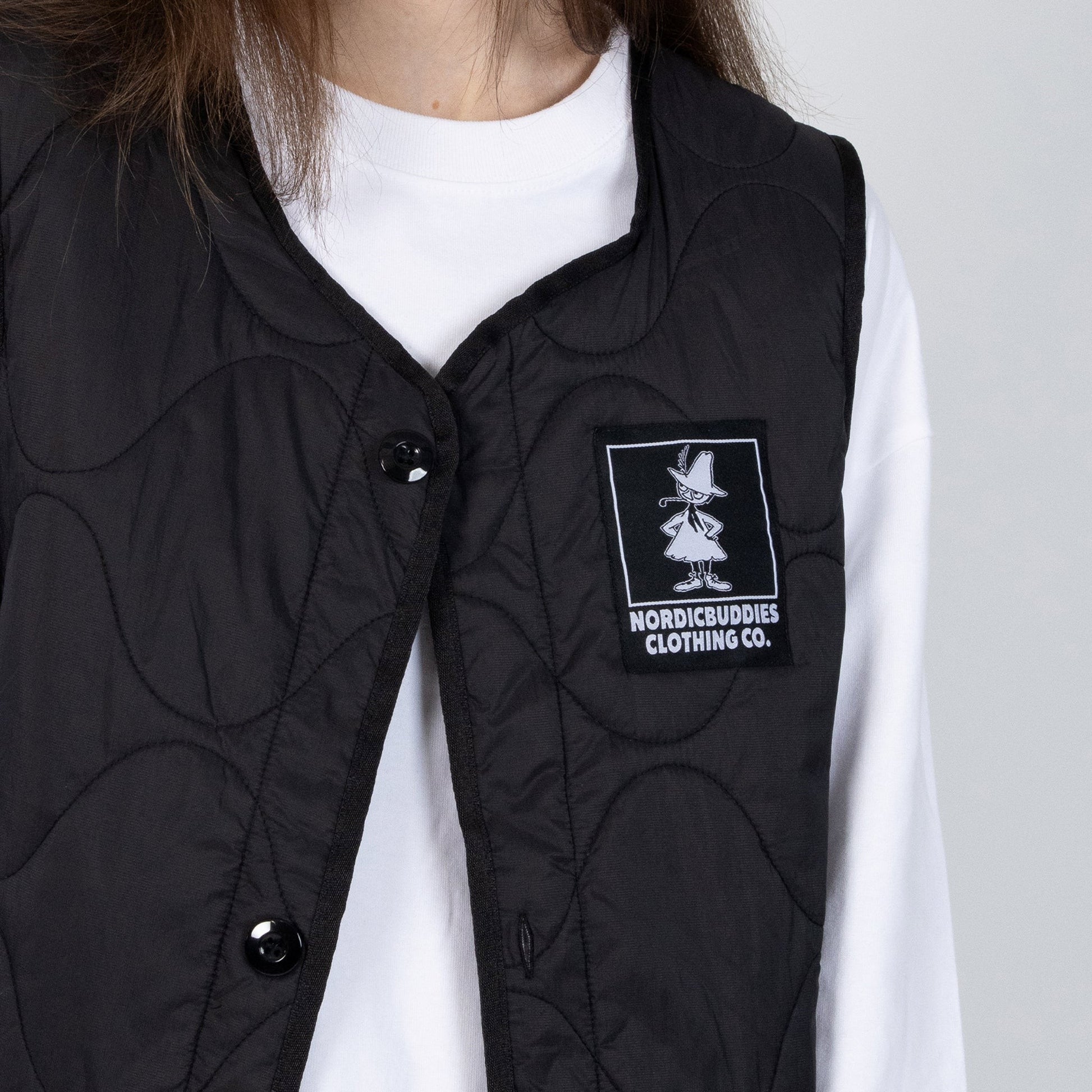 elegant black snufkin fishing vest for men and women, shown in a refined studio portrait
