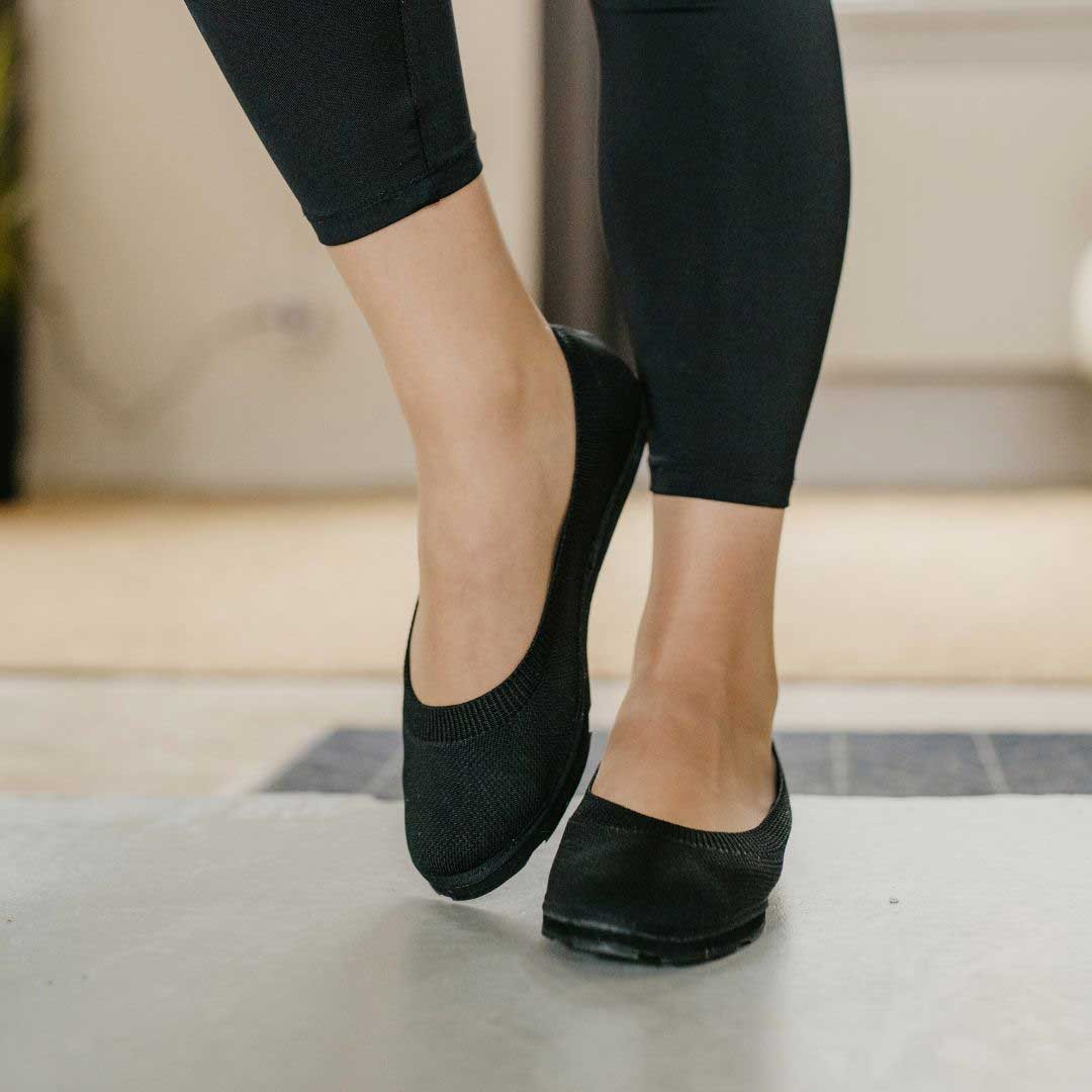 bold upcycled ballerina shoes with recycled tyre soles, sleek black knit upper, and organic tencel lining
