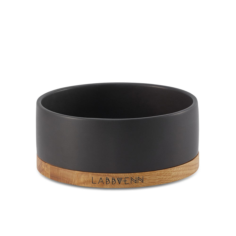 bold black ceramic pet bowl on a chic oak base - confident dining style