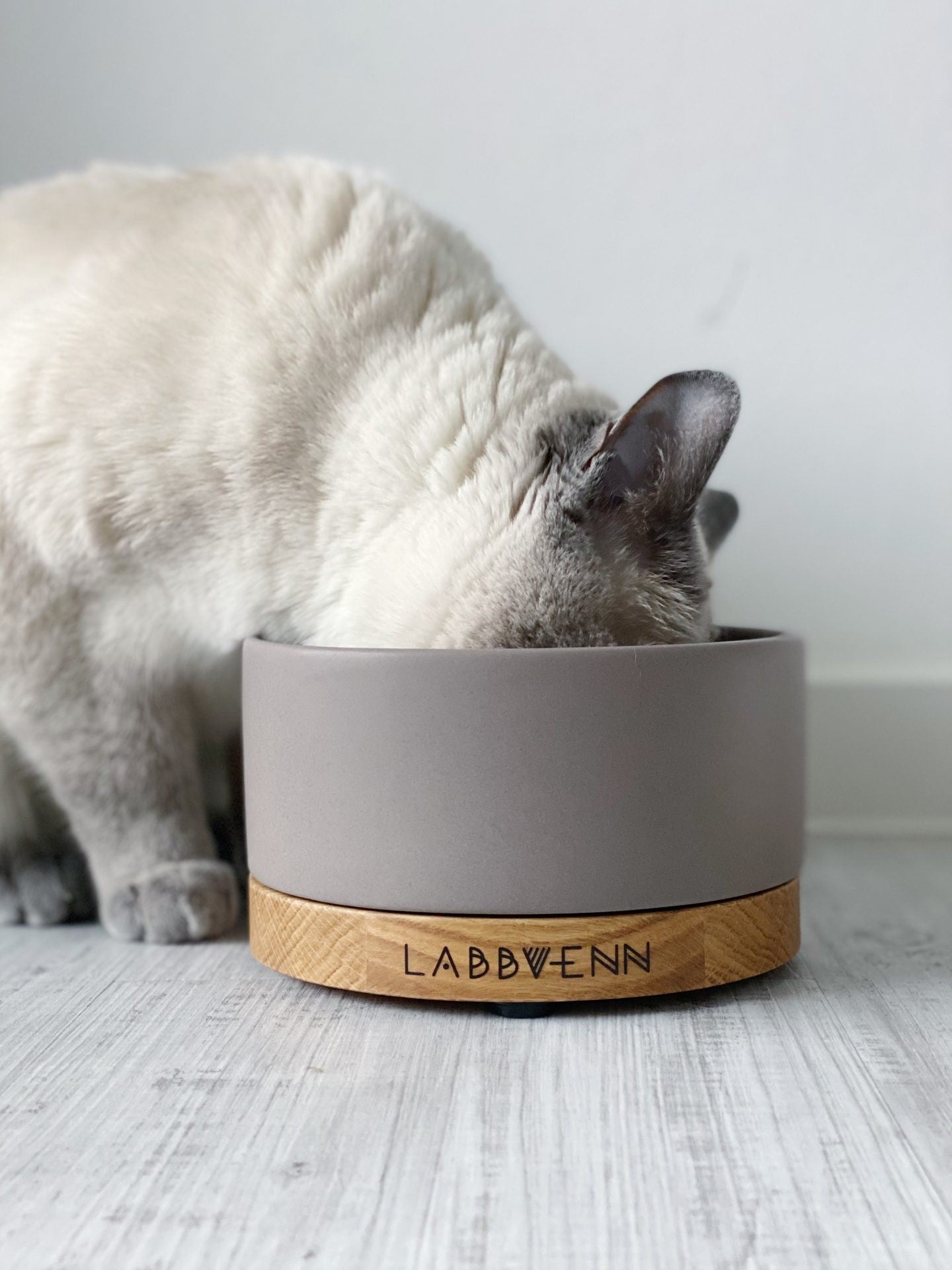 bold vuku ceramic pet feeder with cocoa bowl on rich oak base, elevated dining