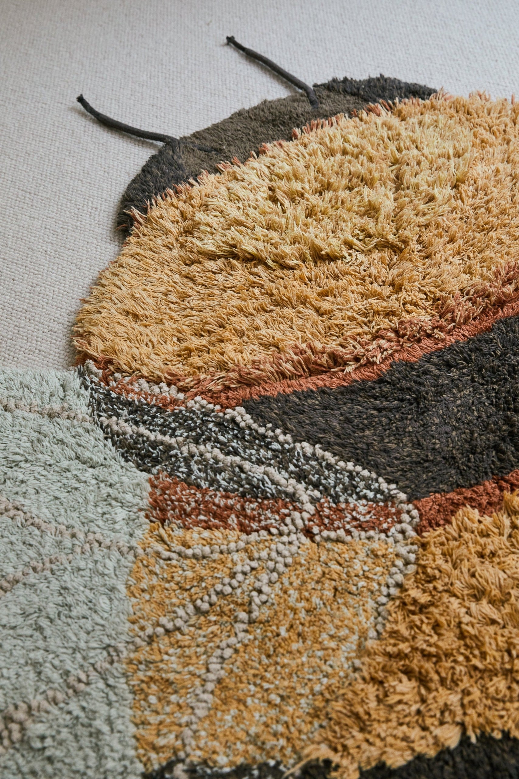 Transform Your Child's Room with a Fun & Educational Bee-Shaped Rug - Eco-Friendly and Handcrafted by Lorena Canals at www.brixbailey.com