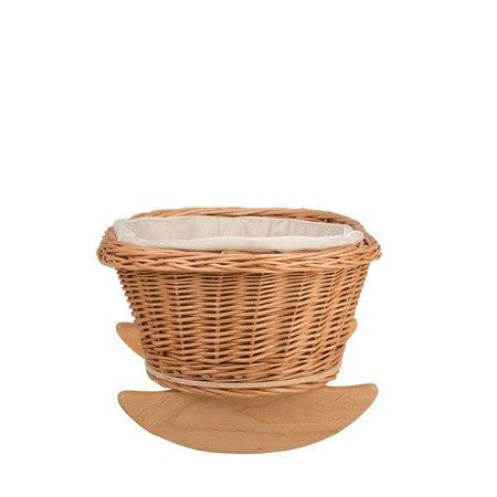 functional wicker doll cradle with white bedding shown from a practical side angle, perfect for playrooms