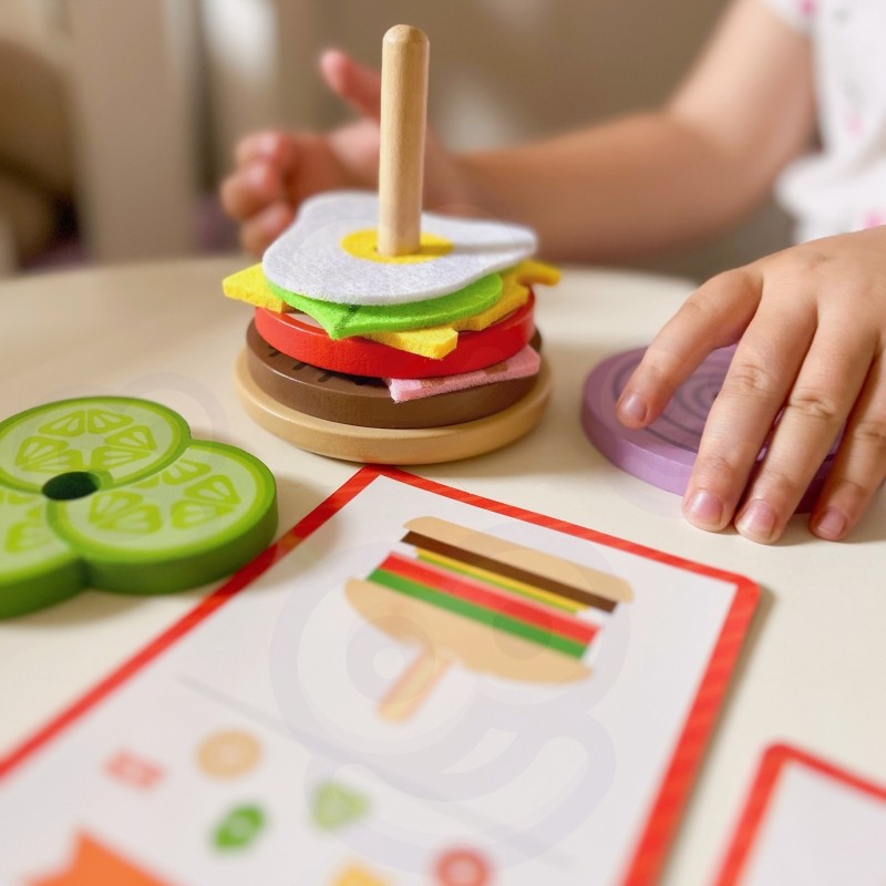 wooden burger puzzle pieces laid out for easy assembly and storage