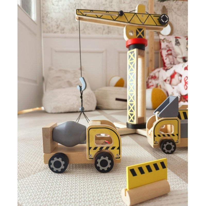 close-up of the artisan-made wooden crane lifting a block in warm morning light