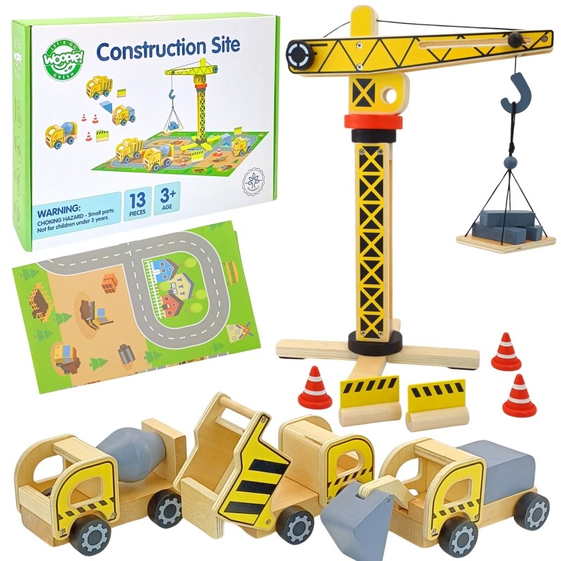 a child's hands carefully assembling the wooden crane from the sustainable playset
