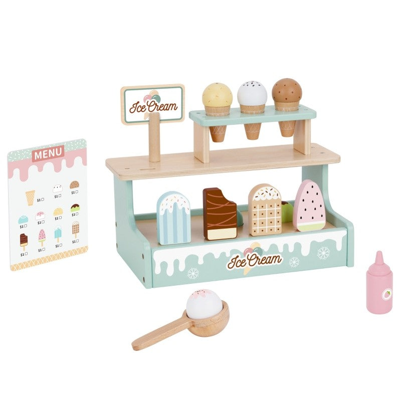 a child's hand gently placing a wooden ice cream scoop on a cone at the soft green stand