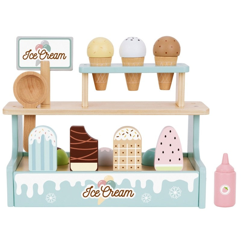 a child's hand proudly serving a towering green wooden ice cream cone with colorful magnetic scoops