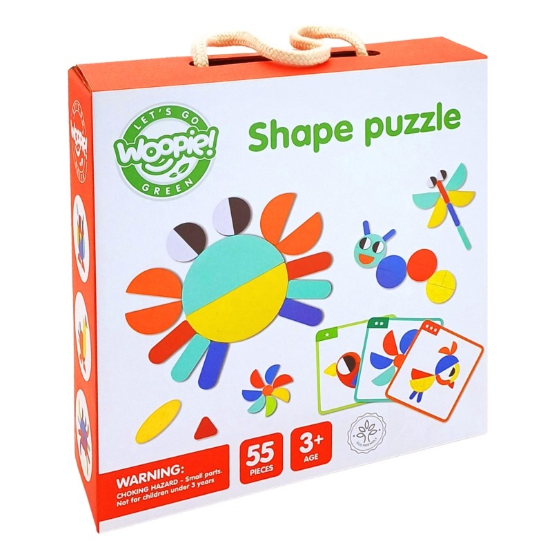a soft-focus close-up of a child's hands placing a wooden butterfly shape onto a puzzle board