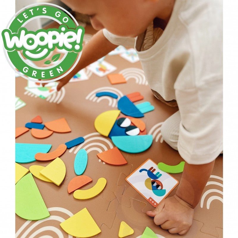 a child's hands arranging wooden puzzle pieces into a new creative design on a sunlit table