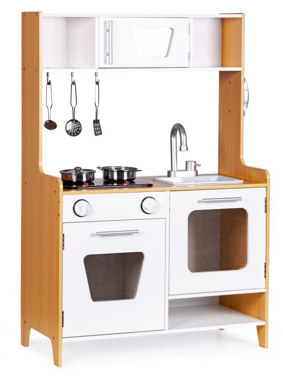 a child's hands using the wooden toy kitchen's metal utensils on the glowing hob